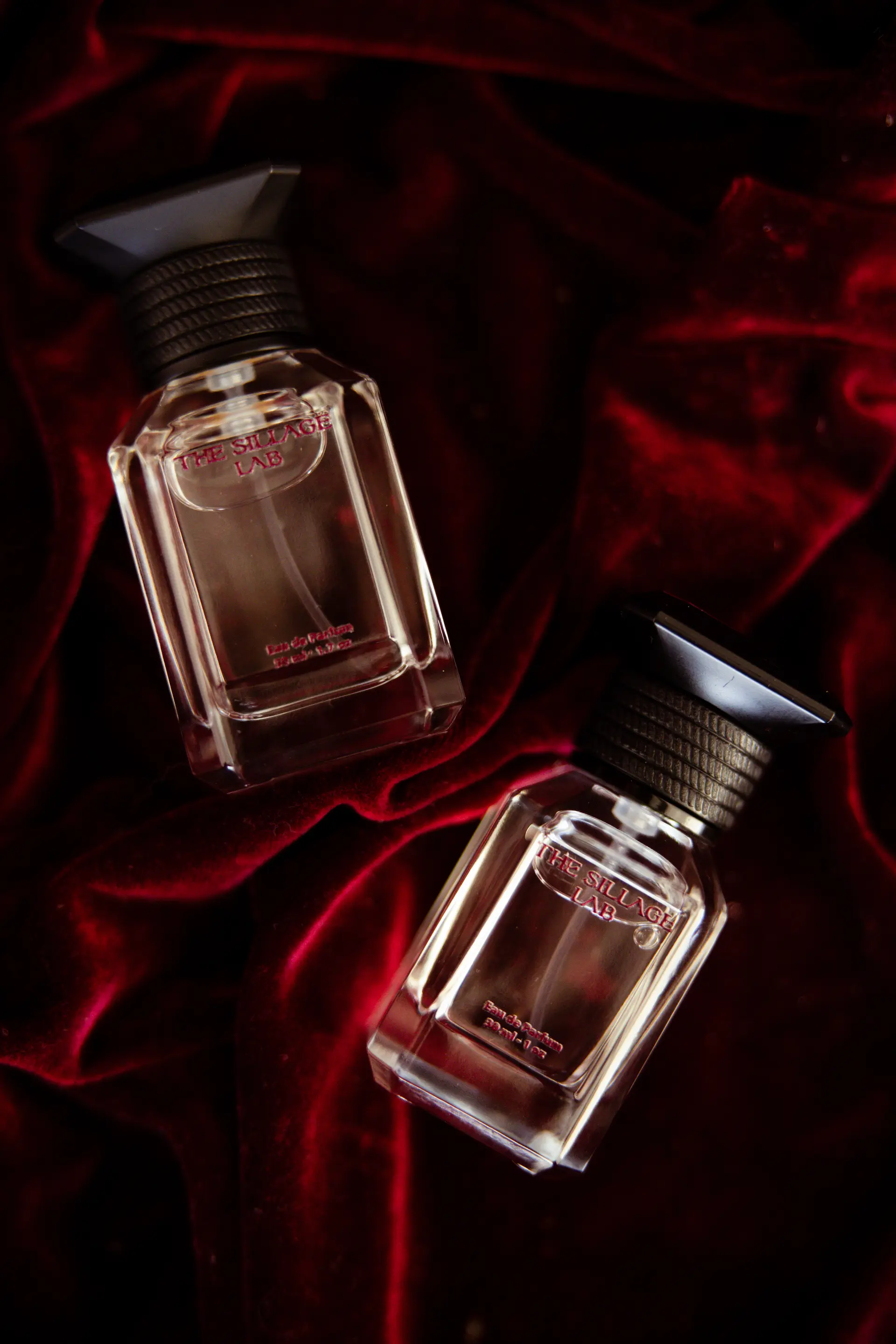 The Sillage Lab luxury perfume bottles on red velvet